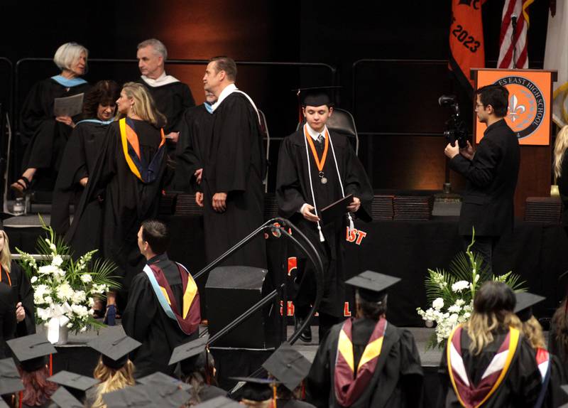 St. Charles East graduates cross the stage for their diplomas during the school’s 2023 commencement ceremony at Northern Illinois University in DeKalb on Monday, May 22, 2023.