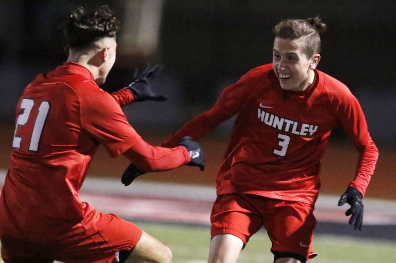 Huntley's Zach Heitkemper, left, runs in for the hug with teammate Hayes Porsche after Porsche's goal against Dundee-Crown during their IHSA Class 3A boys soccer sectional semifinal game at Huntley High School on Wednesday, Oct. 27, 2021 in Huntley.