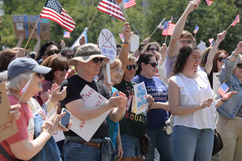Approximately 1,200 people react to DuPage County Recorder Liz Chaplin speak while participating in the nationwide No Kings Day Rally at Glos Memorial Park in Elmhurst Saturday June 14, 2025.