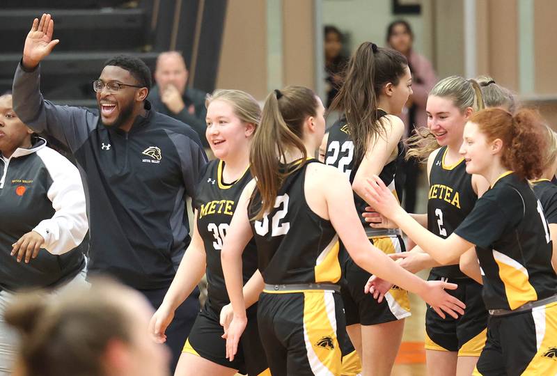 Metea Valley players and coaches celebrate after a run that forced a DeKalb timeout during their game Thursday, Jan. 19, 2023, at DeKalb High School.