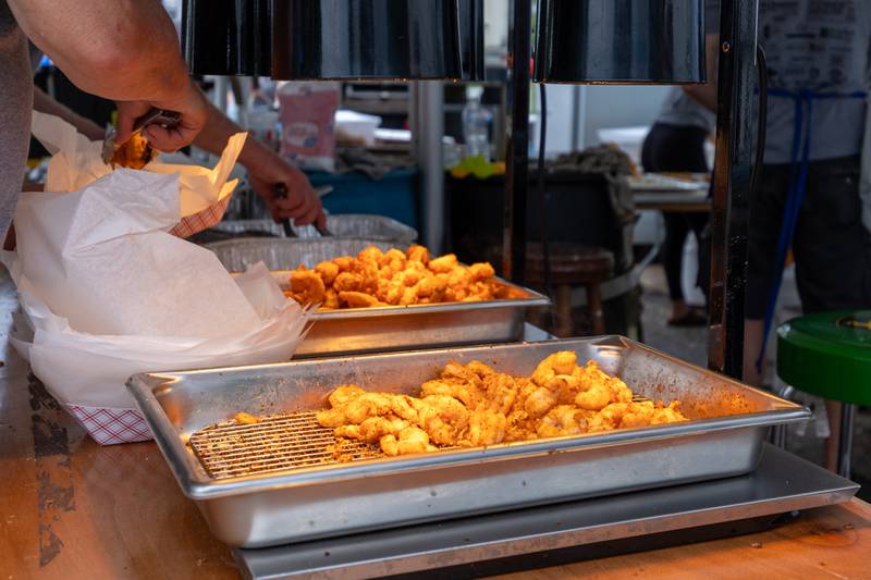 Fried shrimp sits in trays before being served at the annual Shrimp Fest on Saturday, June 7, 2025 at Rotary Park in Princeton.