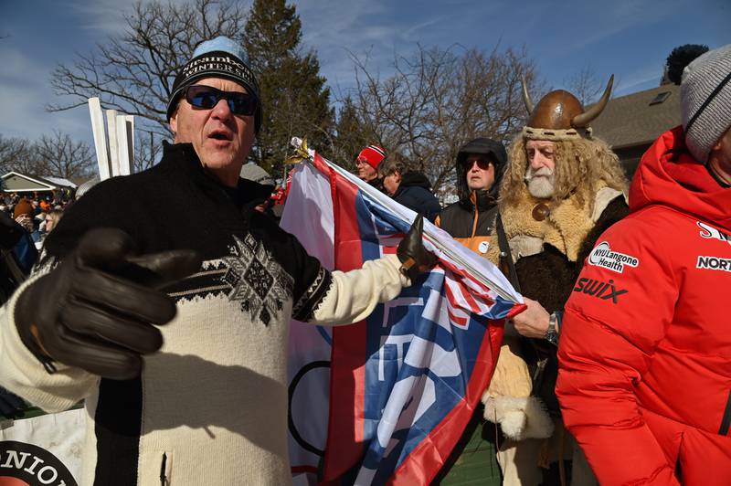 Right, in horn hat, holding a flag, is Marty Knapp of Fox River Grove at the Norge Ski Jump 121st Annual Winter Tournament on Feb. 1, 2026 at the Norge Ski Club, 100 Ski Hill Road, Fox River Grove.