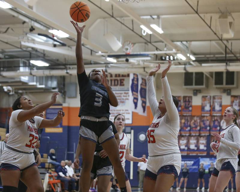 Oswego East's Avay Kittling-Turner (3) puts in a basket during their basketball game between Oswego East at Oswego Friday, Jan 09, 2025 in Oswego.