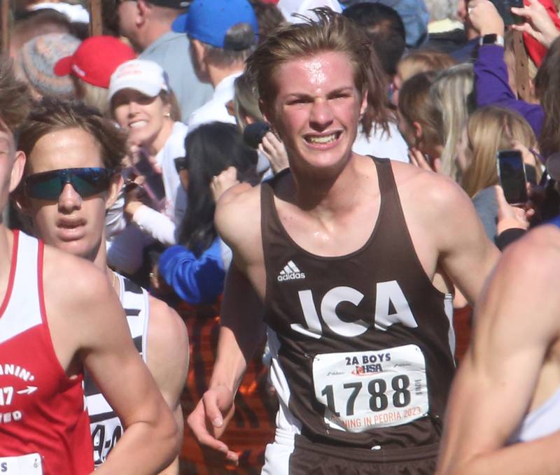 Kaneland's Evan Whildin and Joliet Catholic Academy's Nathan Ciarlette compete in the Class 2A State Cross Country race on Saturday, Nov. 4, 2023 at Detweiller Park in Peoria.