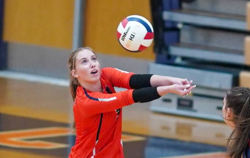 Oswego’s Grace Petasnick (2) bump sets the ball against Rosary during a volleyball match at Oswego High School on Tuesday, Aug 29, 2023.
