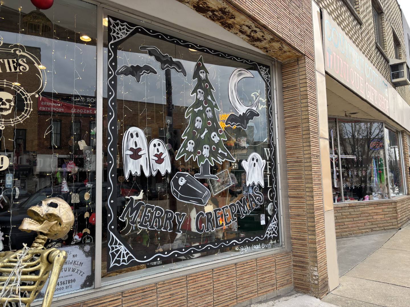 Lacey Haltenhof painted this window for Christmas, but made it a little spooky for Chaos and Curiosities in downtown La Salle.