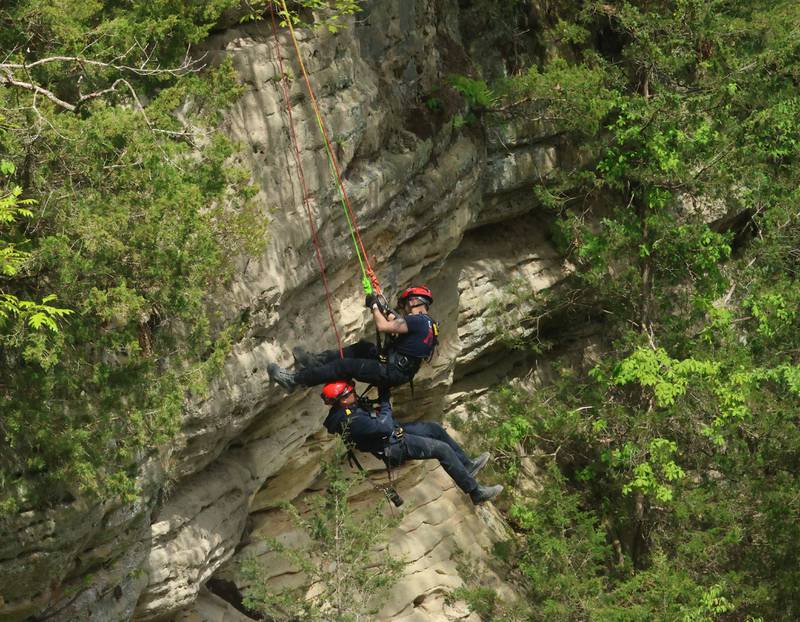 Ottawa firefighters Devin Fleming annd Brazon Wheeler are hoisted upward into Wildcat Canyon during rope rescue training on Saturday, May 2, 2026  at Starved Rock State Park.