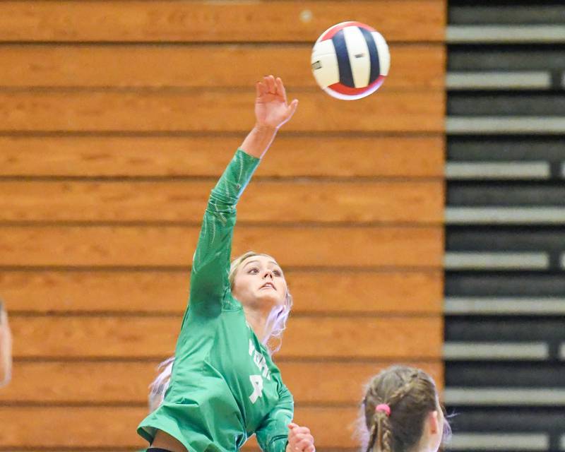 York's Katie Day (4) spikes the ball over the net during the regional title game while taking on Lyons Township on Thursday Oct. 30, 2025, held at York High School.