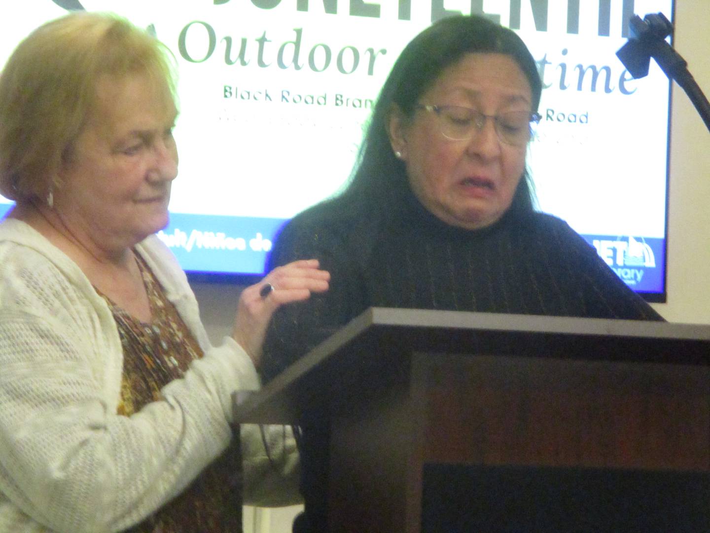 Fellow nurse Marcy Simon comforts Raquel Mata, who became emotional as she talked at a town hall meeting Wednesday about the elimination of the pediatric unit at Saint Joseph Medical Center. Mata a pediatric nurse, retired after the unit was eliminated on May 1. May 21, 2025