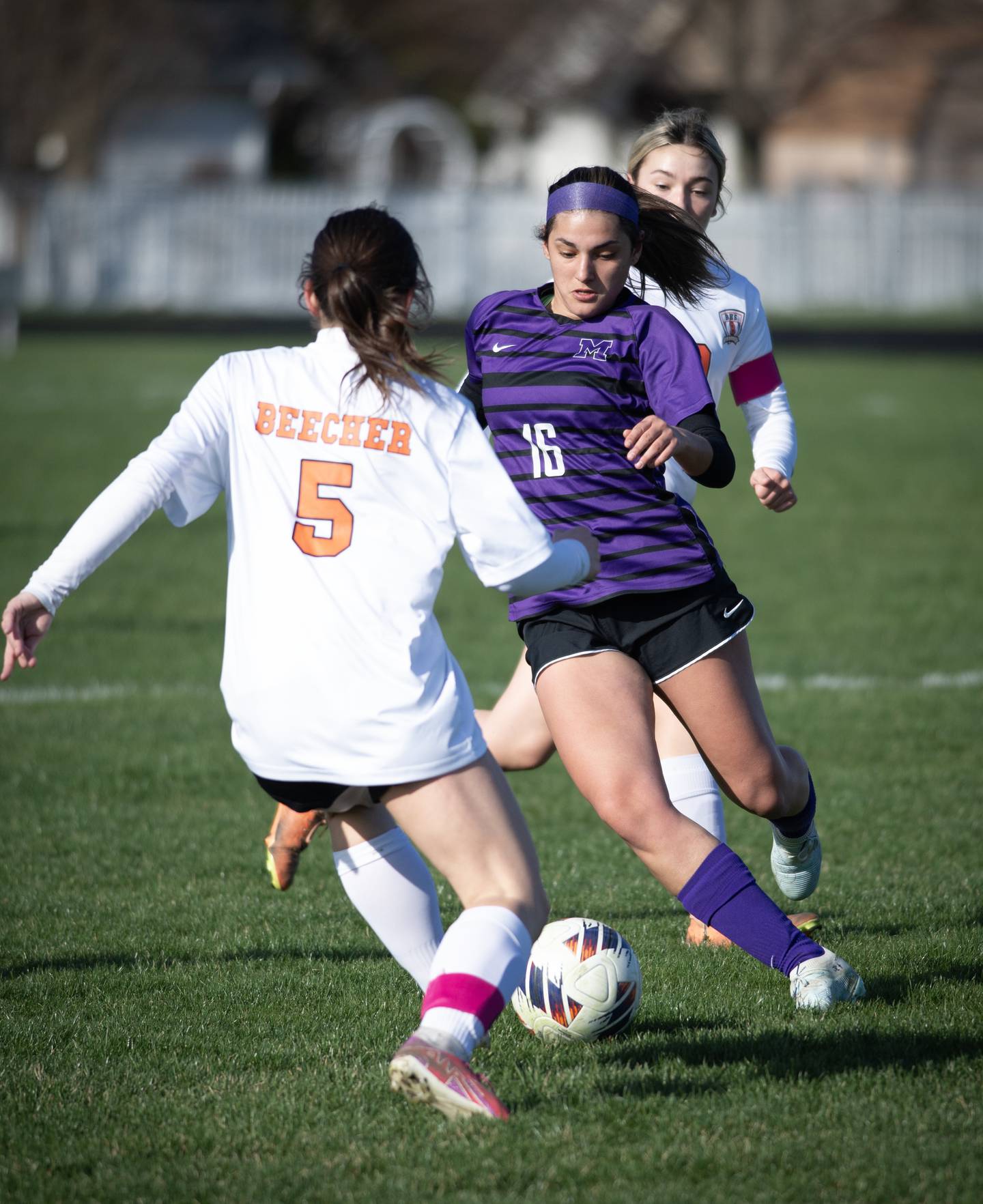 Manteno's Michelle Carrera controls the ball as Beecher's Teagan Claus challenges her during Monday's game in Manteno.