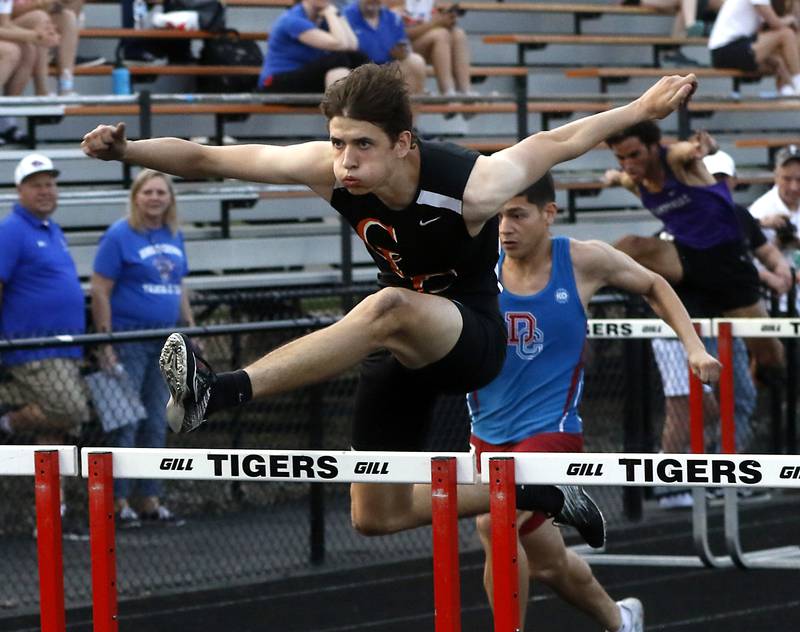 Crystal Lake Central’s Jonathan Tegel flies over a hurdle in the 110 meter hurdles during Fox Valley Conference boys track and field meet Friday, May 13, 2022, at Crystal Lake Central High School.