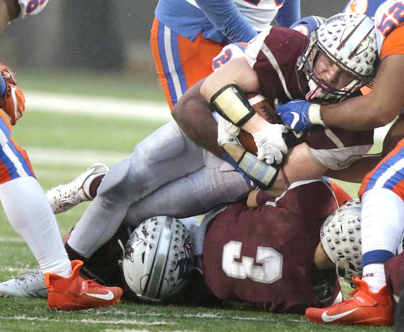 Prairie Ridge senior Kyle Koelblinger drives for extra yardage during their Class 6A state football championship game against East St. Louis Saturday in Huskie Stadium at Northern Illinois University.