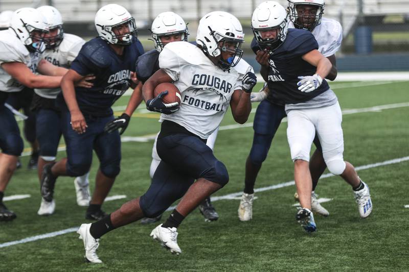 Plainfield South running back Brian Stanton carries the ball during practice on Wednesday, Aug. 18, 2021, at Plainfield South High School in Plainfield, Ill.