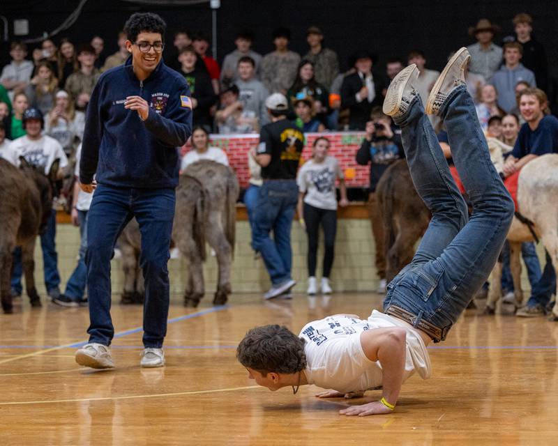 Joey Arnold does the 'worm' whilst competing in a tie-breaking dance-off after game of Donkey Basketball on Saturday, Feb. 7, 2026 at Seneca High School West Campus in Seneca.