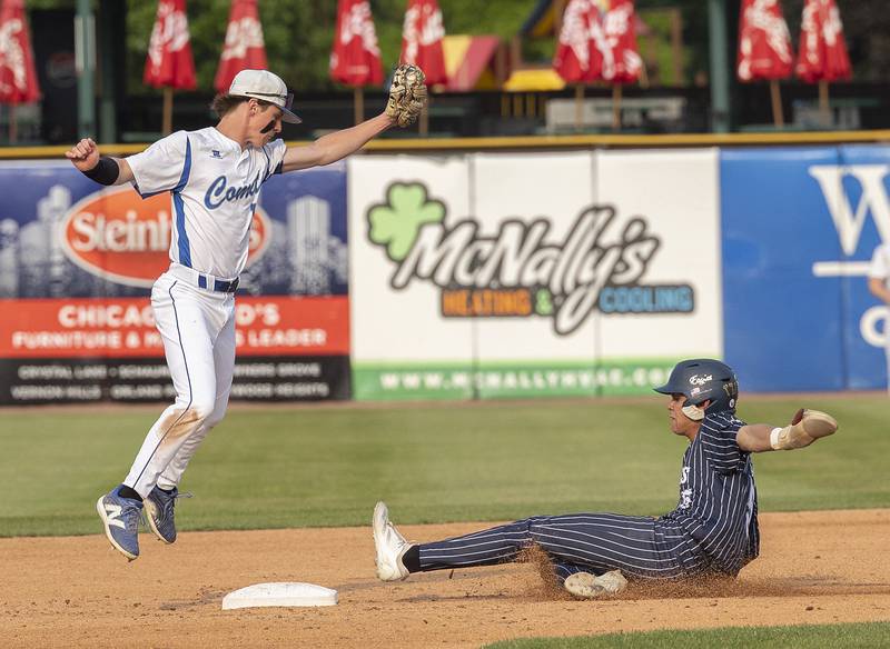 Newman’s Liam Nicklaus snags a throw but can’t tag out Chicago Hope’s Matthew Mendez Monday, June 2, 2025, during the Class 2A Supersectional at Northwestern Medicine Field in Geneva.
