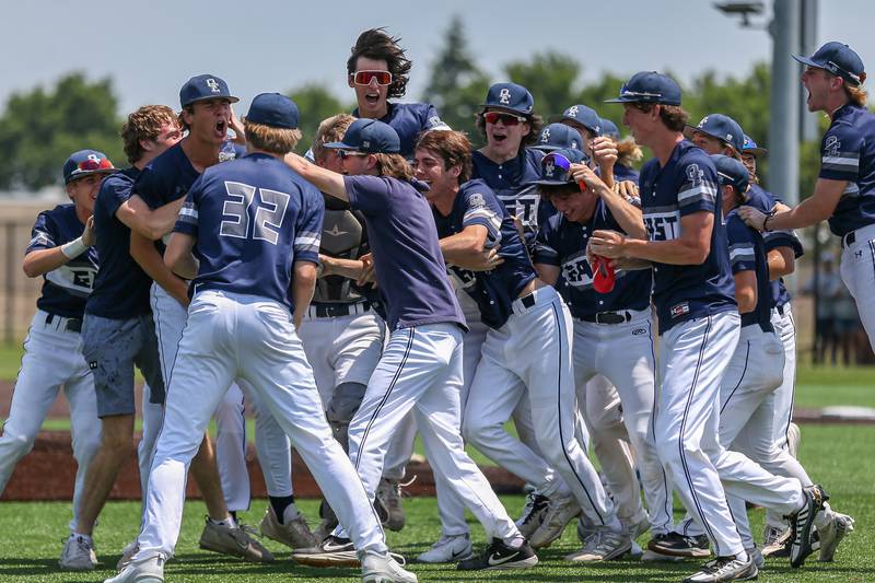 Oswego East celebrates the victory over Oswego in their Class 4A Romeoville Sectional final game.  June 3, 2023.