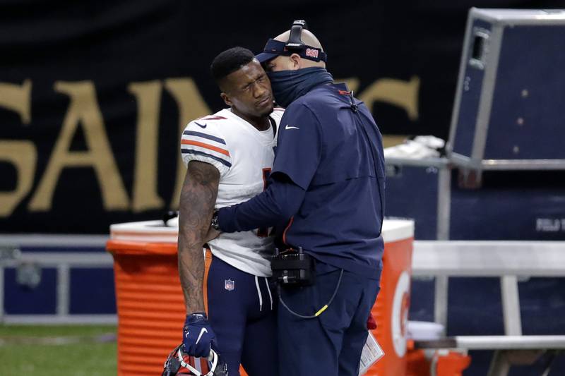 Chicago Bears wide receiver Anthony Miller reacts as head coach Matt Nagy talks to him, after he was ejected for unsportsmanlike conduct in the second half of an NFL wild-card playoff football game against the New Orleans Saints in New Orleans, Sunday, Jan. 10, 2021. (AP Photo/Brett Duke)