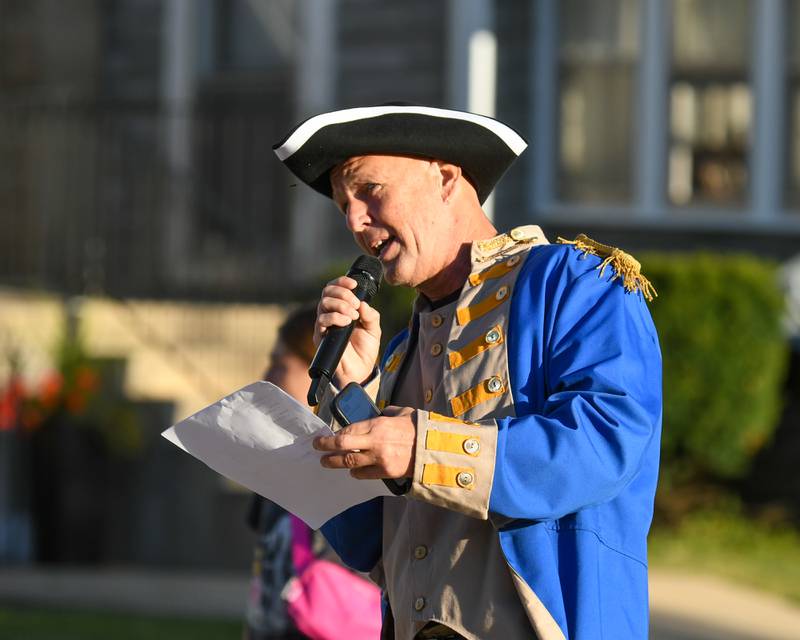 Justin Carlson, dressed as Baron Johann DeKalb, gives remarks before the start of the DeKalb Corn Classic on Sunday, Sept. 29, 2024.