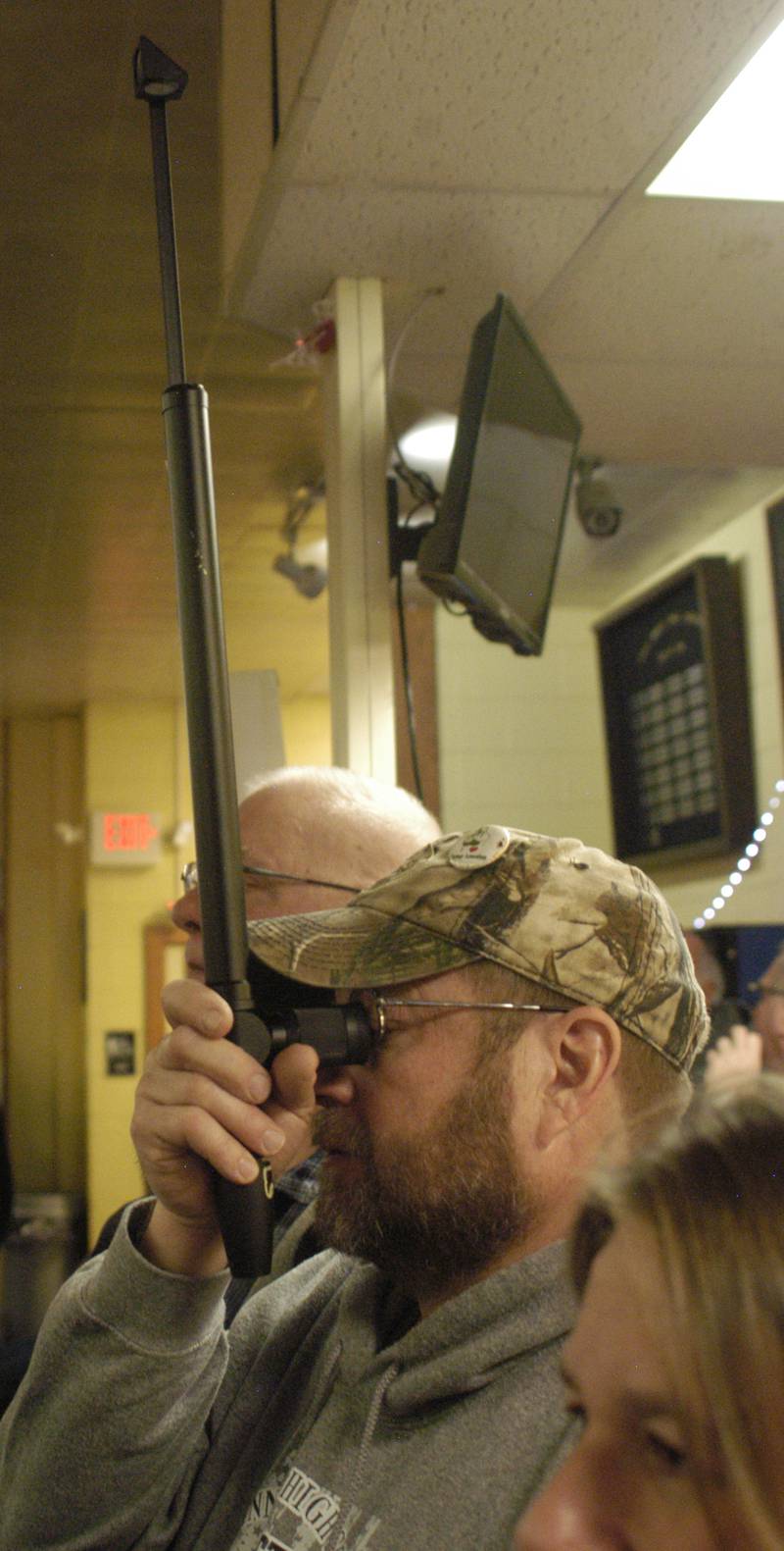 Oregon fan Mark Stahl uses a periscope to watch the action. Bowling teams  competed in the Sterling Regionals on Saturday, Jan. 17, 2026 at Blackhawk Lanes in Sterling.