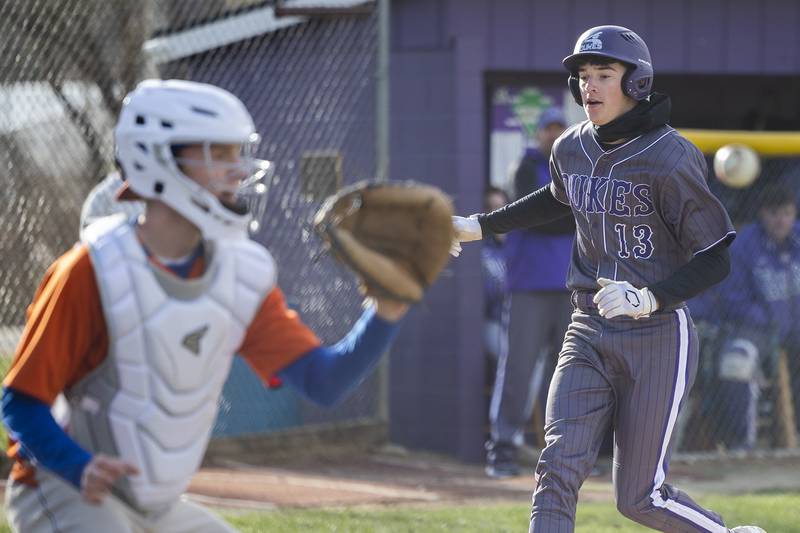 Dixon’s Kellen Haenitsch tags up a scores against Genoa-Kingston Monday, April 7, 2025.