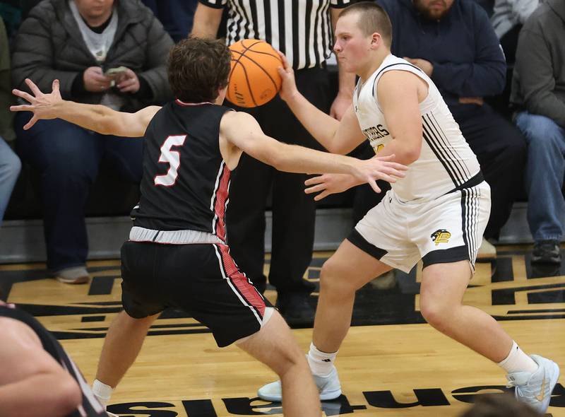 Putnam County's Traxton Mattingly dribbles around Henry-Senachwine's Jacob Miller on Friday, Dec. 5, 2025 at Putnam County High School.
