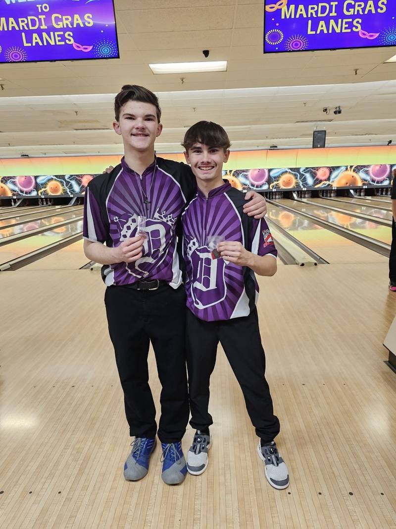 Dixon's David Laird, left, and Daniel Sotelo are pictured after the Dukes took second at the Kaneland Regional on Friday, Jan. 18 to advance to the sectional as a team. Sotelo was runner-up and Laird took third.