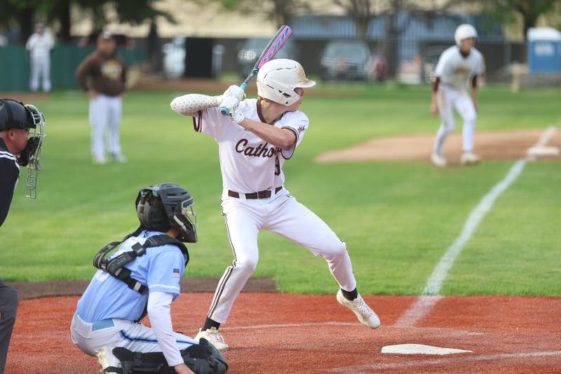 Cody Busch locks in on a pitch to pull Joliet Catholic within a run against Nazareth on Wednesday, April 29, 2026 in Joliet.