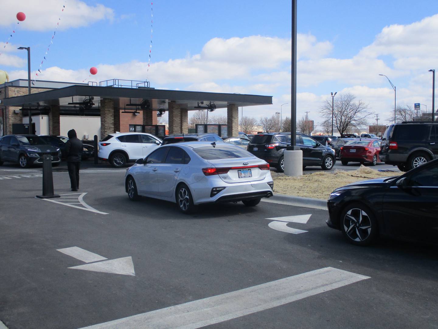 Cars line up for the drive-thru lanes at the Raising Cane's Chicken Fingers restaurant that opened at 3000 Plainfield Road in Joliet on Tuesday, March 8, 2022.