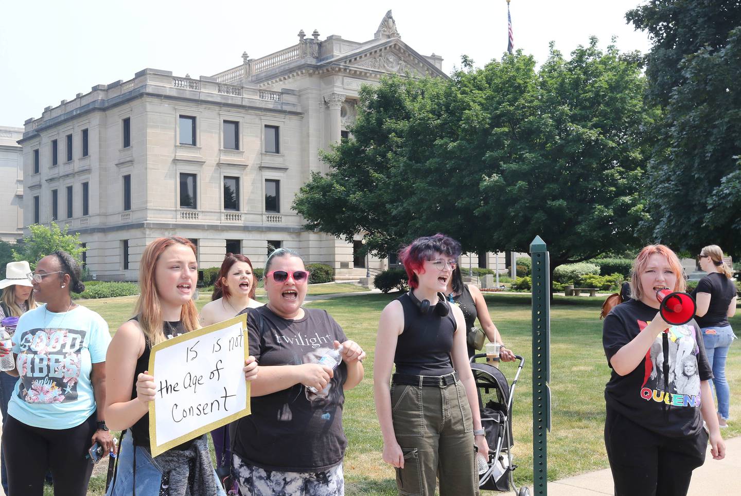 Protesters speak out Wednesday, June 14, 2023, in front of the DeKalb County Courthouse in Sycamore. The group is asking for harsher sentences for those convicted of domestic or sexual abuse. They gathered shortly after the arraignment hearing of Timothy M. Doll, a registered sex offender charged with murder in DeKalb teenager Gracie Sasso-Cleveland’s death.