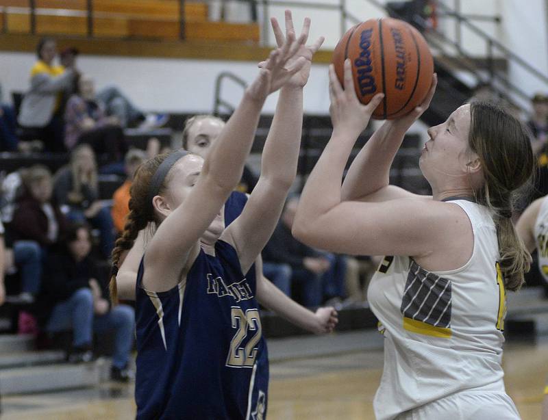 Marquette’s Maera Jimenez tries to block a shot by Putnam County’s Mikenna Boyd in the 1st period on Wednesday, Dec. 14, 2022 at Putnam County High School.