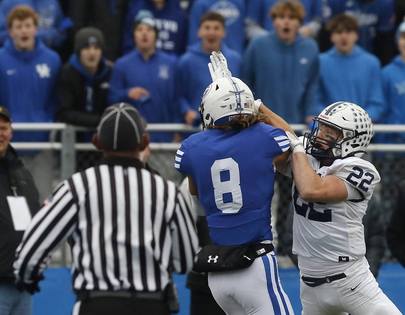 Geneva's Finnegan Weppner catches a touchdown pass in front of Cary-Grove's Michael Dunkin during an IHSA Class 6A semifinal football game on Saturday, Nov. 23, 2024, at Geneva High School.