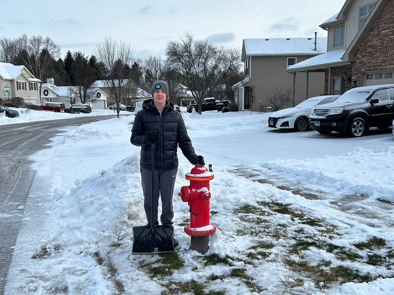 Ben Kaluza after clearing the area around the fire hydrant in his neighborhood.