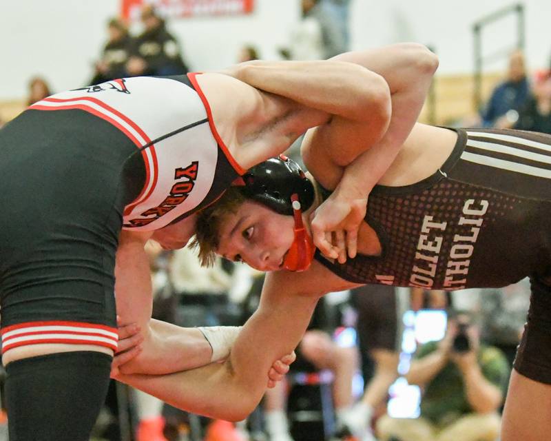 Maddux Tindal of Joliet Catholic Academy, right, keeps his eyes on Liam Fenoglio of Yorkville in the 120-weight class during the regional meet on Tuesday Feb. 25, 2025, held at Yorkville High School.