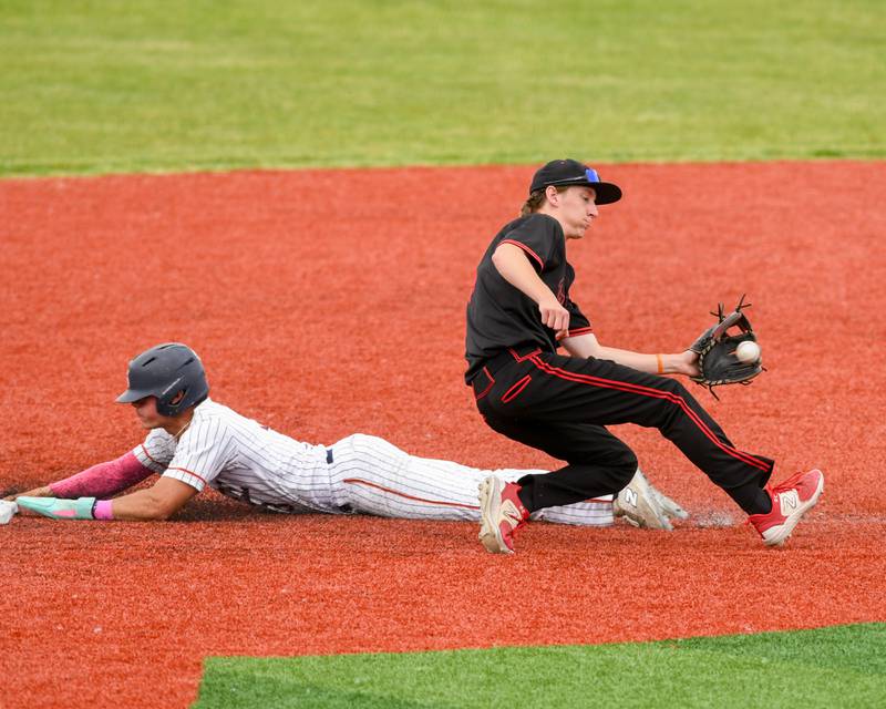 Romeoville's Karlos Otero (3) steels second base safely as Yorkville's Kamden Muell (9) waits for the ball during the regional game on Thursday May 29, 2025, held at Yorkville High School.