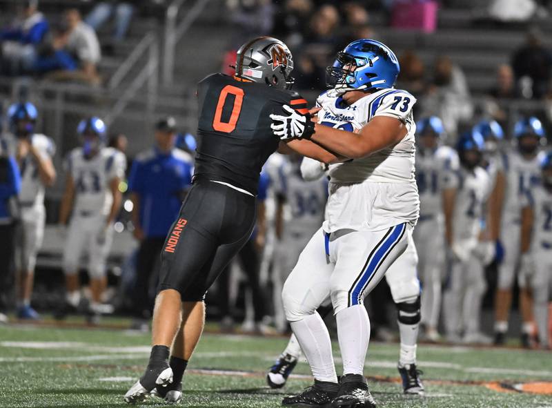 St. Charles North's Ty Weiersheuser (73) blocks Minooka's Brady Kozlowski (0) during the non-conference game on Friday, Aug. 29, 2025, at Minooka.