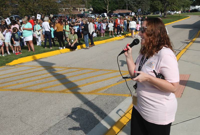 Sarah Frankiewicz, Southeast Elementary School principal, greets students on their first day of classes Thursday, Aug. 21, 2024, at the school in Sycamore. It was also Frankiewicz’s first day as principal at the school she attended as a student.