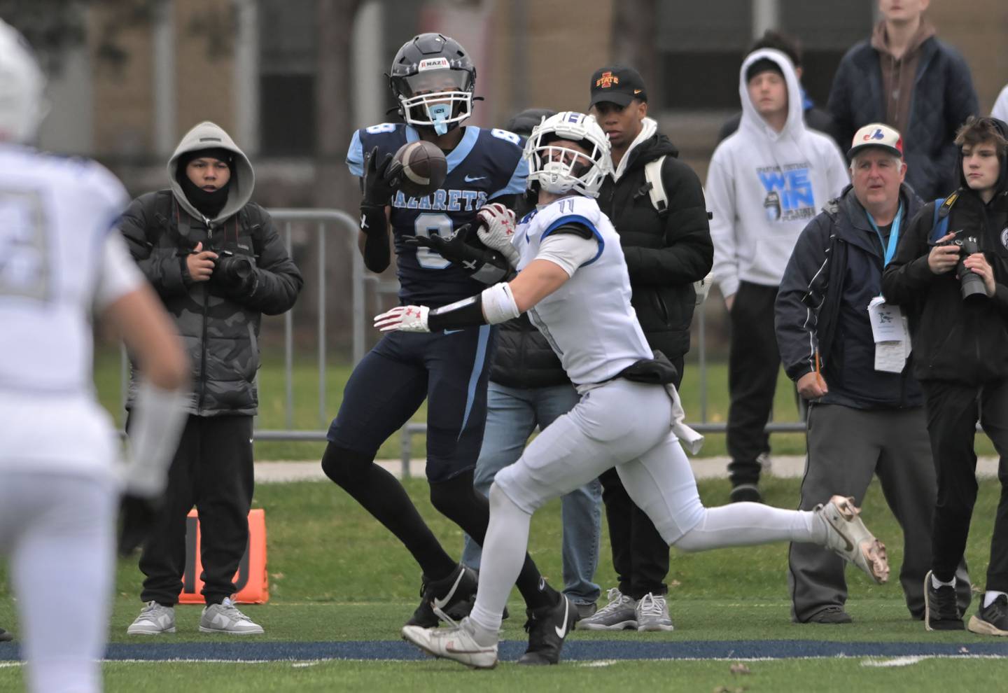 Nazareth’s Trenton Walker catches a touchdown pass in the first quarter as St. Francis’ Tanner Glock defends in the IHSA Class 5A state semifinal football game in La Grange on Saturday, Nov. 23, 2024.
