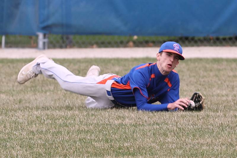 Genoa-Kingston's Connor Grimm makes a diving catch during their game against Winnebago Tuesday, April 12, 2022, at Genoa-Kingston High School.