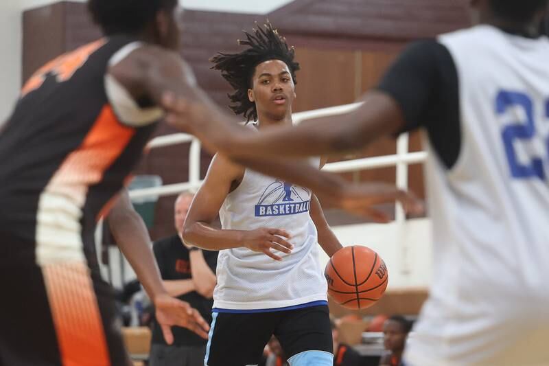 Joliet Central’s Glenn Harper works the ball up-court against DeKalb at the 37th Morris Boys Shootout on Tuesday, June 25, 2024.