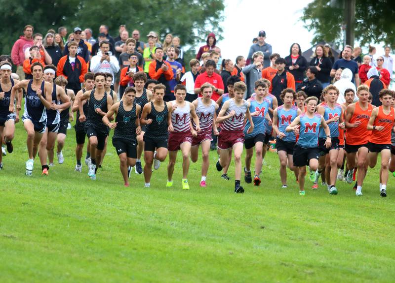 Boys begin the varsity race during the McHenry County Cross Country Meet at Emricson park in Woodstock on Saturday, August 30, 2025.