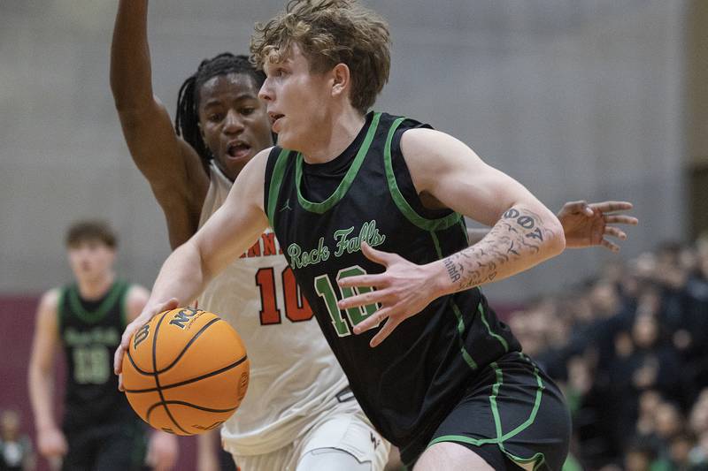 Rock Falls’ Kuitim Heald drives the baseline against Winnebago’s Myles Smith Tuesday, March 4, 2025, during the 2A boys basketball Sectional final at Marengo.