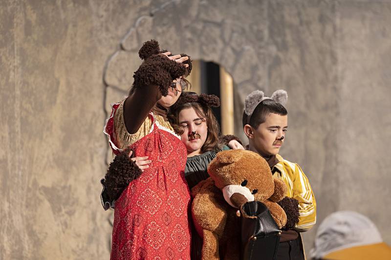 The Bear Family, mama, Charlie Trader (left), baby, Camille Kutz and papa Max Gingris act out a scene during rehearsal Thursday, Jan. 11, 2024.