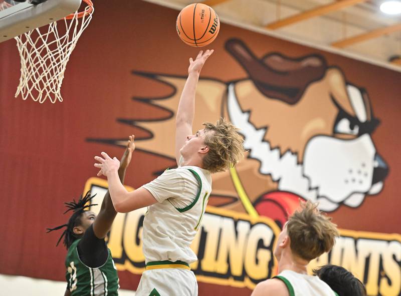 Providence Catholic's Reese Kras (12) goes up for a shot during the WJOL tournament game against Plainfield Central on Friday, NOV. 28, 2025, at Joliet.