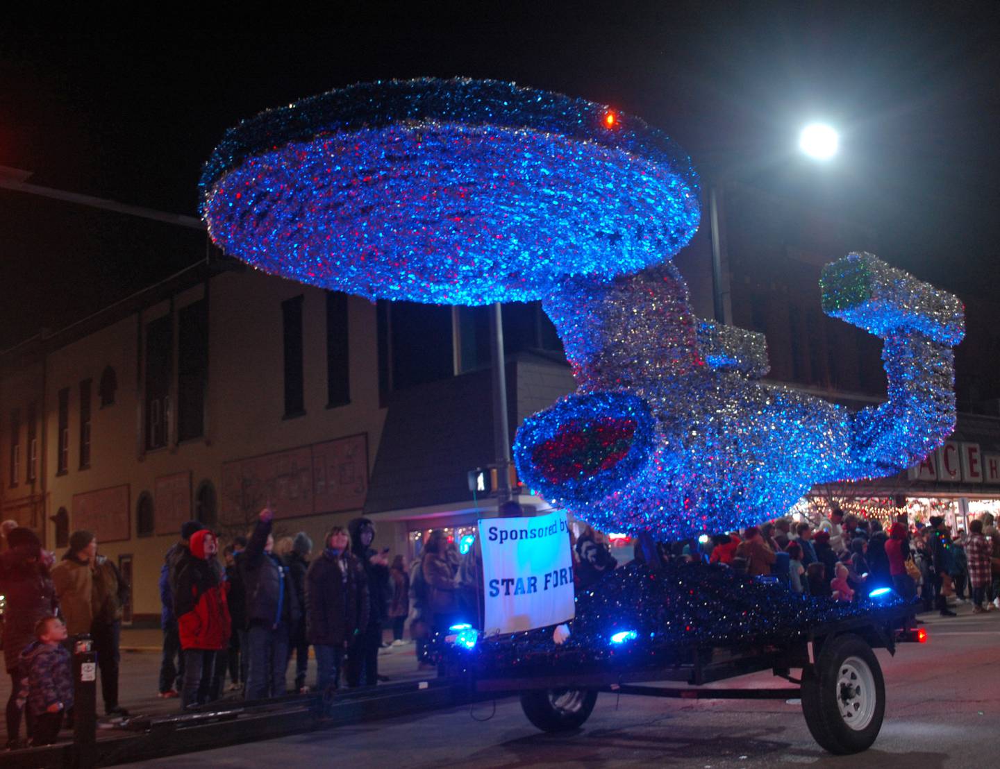 The Starship Enterprise float sponsosed by Star Ford awes young paradegoers as it travels down Main Street during the Keeping Christmas Close to Home lighted parade Saturday, Nov. 26, 2022 in downtown Streator.