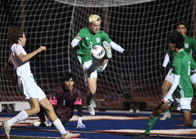 John Starks/jstarks@dailyherald.com
York’s Ryder Kohl clears the ball from in front of the net in the Class 3A third place game of the boys state soccer tournament against Stevenson in Hoffman Estates on Saturday, November 5, 2022.