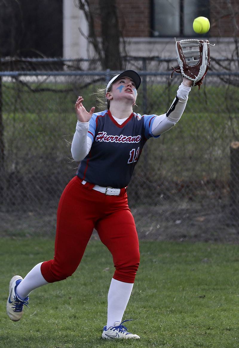 Marian Central's Mia Convey chased down a fly ball during a nonconference softball game against Crystal Lake Central on Thursday, April 3, 2025, at bates Park in Woodstock.
