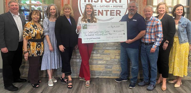 DeKalb County Community Foundation grant committee and executive director Dan Templin presenting a $100,000 check to the DeKalb County History Center