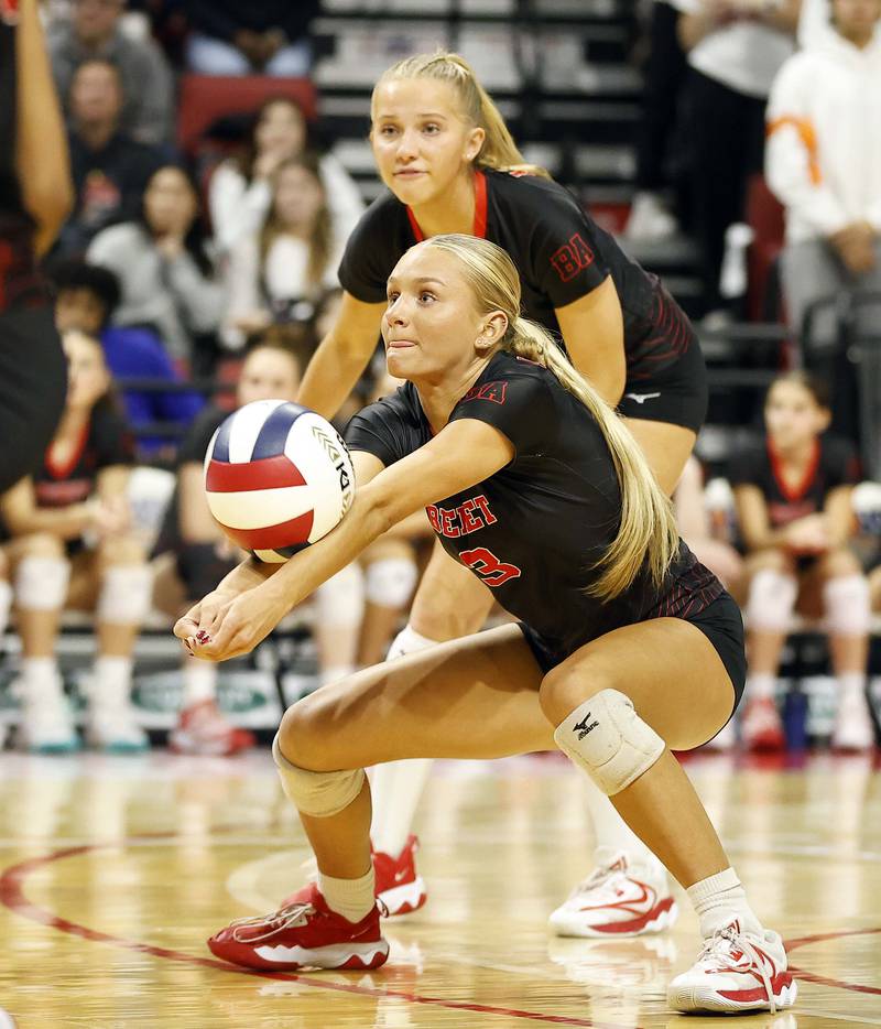 Benet Academy's Ava Ledebuhr (3) returns a shot during the IHSA Class 4A girls volleyball championship match Saturday, Nov. 16, 2024 at CEFCU Arena in Normal.
