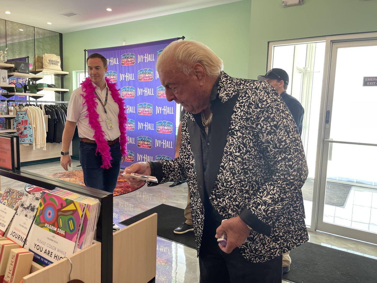 Ric Flair looks at products on Saturday, April 15, 2023, at Ivy Hall Dispensary in Crystal Lake. Flair was in attendance to both meet fans and promote a new line of marijuana products, "Ric Flair Drip."