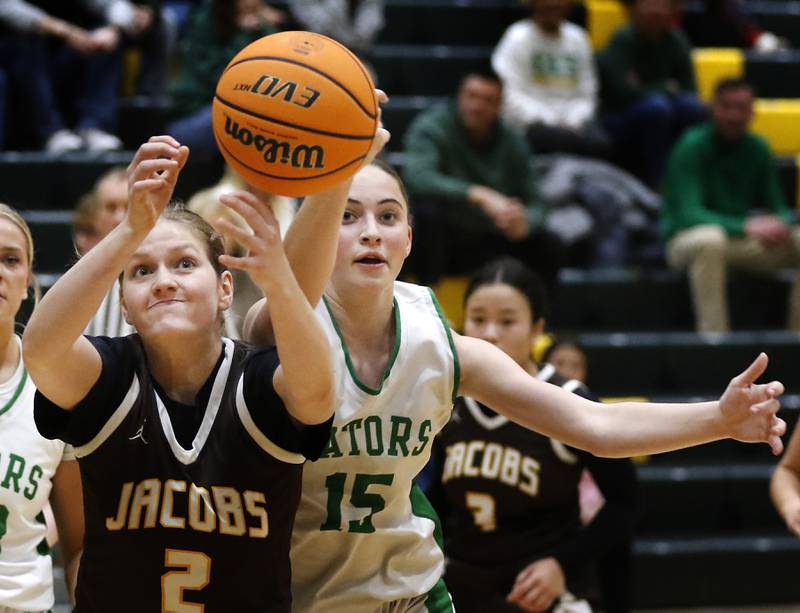 Jacobs' Sarina Acheatel battles with Crystal Lake South's Tessa Melhuish for a rebound during a Fox Valley Conference basketball game on Friday, Jan. 17, 2025, at Crystal Lake South High School.
